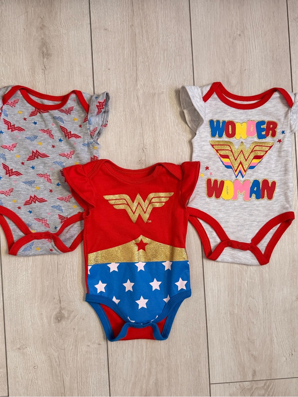 DC Comics Wonder Woman Baby Onesie Trio in Red, Blue, Gray & Gold
